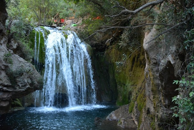 Vibrant waterfall in Akchour, creating a stunning natural spectacle amidst the mountains