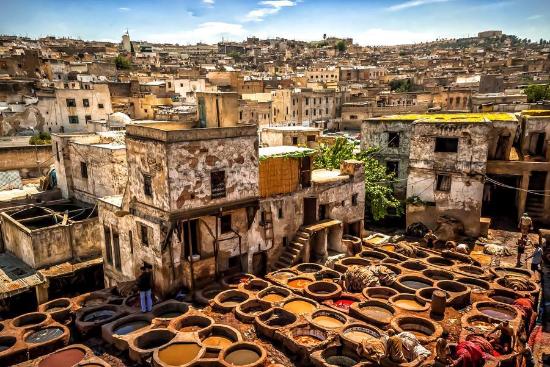 Narrow alleys of Fes el Bali, the ancient medina of Fes, featuring historical architecture and vibrant souks, a must-visit attraction in Morocco.