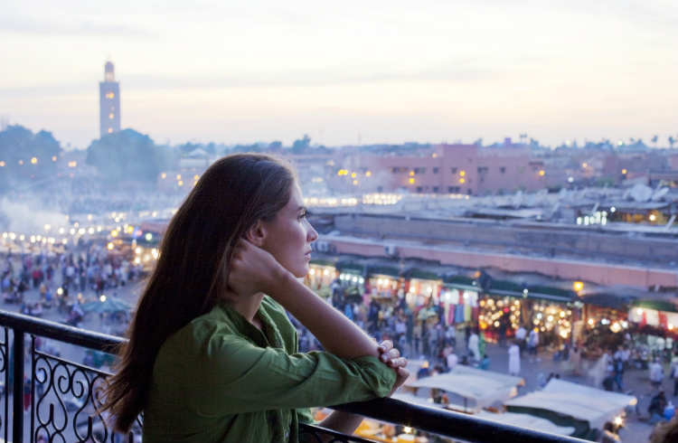 Solo female traveler enjoying a coffee in Marrakech, showcasing the vibrant and safe atmosphere for women exploring Morocco